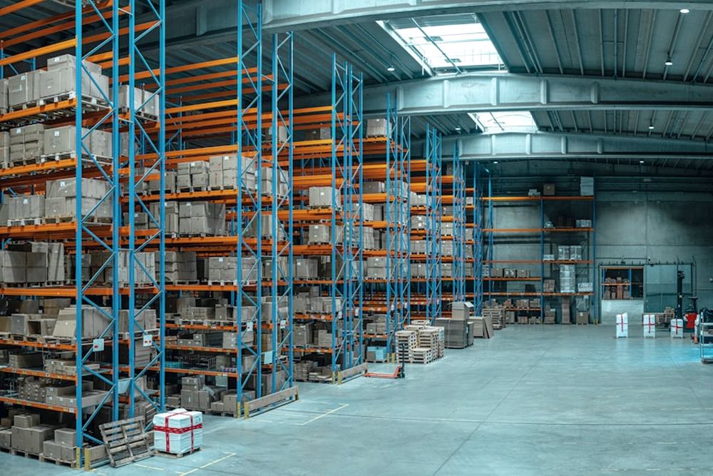 Pallet racking stacked with stock inside a distribution warehouse