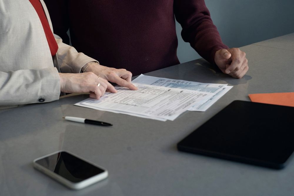 A finance broker going through an application with a client